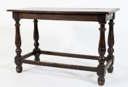 An 18th Century oak rectangular side table:, with a moulded top on turned baluster legs,