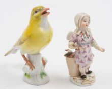 A Meissen figure of a Canary and a figure of a cherub fish seller: the canary on tree stump base,