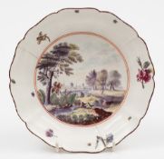 A Chelsea small deep dish: with petal-shaped rim, finely painted with a river landscape,