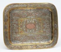 A Indo-Persian brass and silver inlaid tray: of rectangular outline,