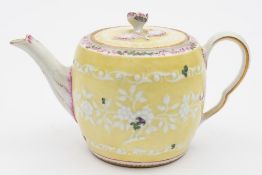 A Worcester barrel shaped teapot and cover: with flower finial and ogee scroll handle,