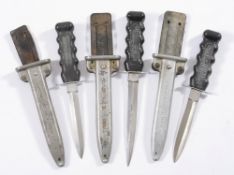 Three variations of a stiletto diving knife by C E Heinke & Co ,London:,
