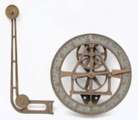A circular bronze weight indicator:,