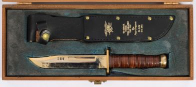 A reproduction Mark V Morse diver's knife:, 6 1/2 inch clipped back blade, ribbed handle,
