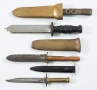 Three various diver's knives:, one with saw backed blade and black rubber handle,