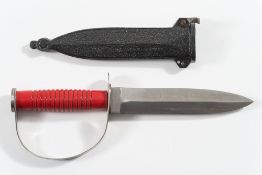 A German 'Frogman' diver's knife by Puma:, the 7 inch double edged blade serrated to one side,