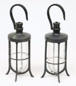 A pair of gunmetal diving or well lamps:, each with hook over four bar body with clear glass shade,