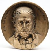 A cast circular bronze commemorative plaque of J N Cabirol:,