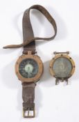 Two brass cased diver's compasses:, both with 1 3/4 inch dial,