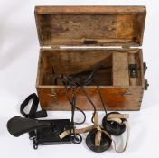 A Swedish single diver telephone by Ericsson:, the oak case with connectors to one end,