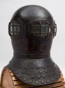 A brass reproduction in the style of Siebe's Open Dress Helmet of 1829:,