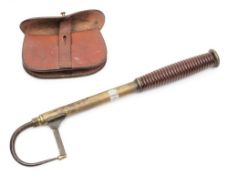 A late 19th Century fisherman's brass and steel gaff: with ring turned mahogany handle, 82cm.