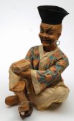 An early 20th century composition clockwork Nodding Chinaman advertising automaton:,