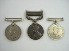 A George V India general service medal with clasp , together with two later WWII service medals:,