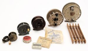 A small brass three bar reel, a half Starback reel, an alloy centre pin reel, two other reels etc:.