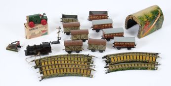 Bing, a tinplate clockwork 0-4-0 tank locomotive:, four passenger coaches, four cattle wagons,