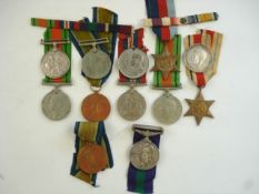 Three War Medals, two Victory Medals and a group of WWII service medals etc:.