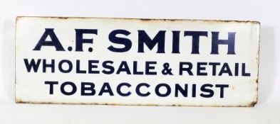 An early 20th century enamel advertising sign for 'A F Smith - Wholesale & Retail Tobacconists':,