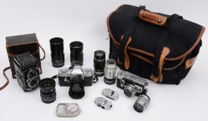 A Leica M3 SLR camera together with a collection of lenses and accessories in a Billingham case:,
