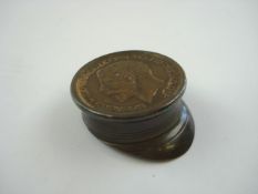 A WWI trench art peaked cap inset 1917 George V penny to top:, 3.5cm long.