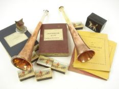 A copper hunting horn by Swaine Adney, together with another hunting horn,