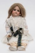 A German bisque head doll:, applied blonde wig, brown glass sleeping eyes ,