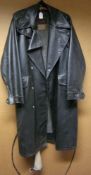 An Armadrake full length leatherette motorcycle coat: with pouch pockets, felt lining and belt.