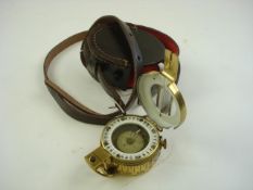 A brass cased MKV style compass in a later leather case:..