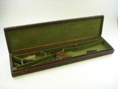 An oak gun case:, with folding brass bail handle to top, fitted interior with green baize,