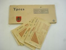 Four unused WWII petrol ration books and a set of Ypres postcards:,