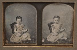 A Stereoscopic daguerreotype of Emily Adeline Studd by Kilburn:, seated holding a doll,