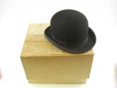 A black felt bowler hat and a black felt Homburg by Herbert Johnson, London, both size 7 in boxes:.