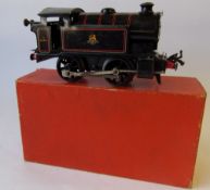 A Hornby No 40 clockwork 0-4-0 tank locomotive, No 82011 in BR black livery: boxed with key.