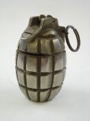 A Mills grenade converted to a money bank:, in a plated finish with coin slot.