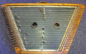 An antique English oak framed hammer dulcimer: 87cm. long.