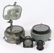 Two aircraft gyro compasses: a flap indicator and a type E2.B compass.