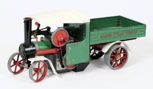 A Mamod live steam wagon: with green, white and red coachwork.
