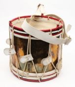 A brass and painted wooden drum by Boosey & Hawkes Ltd, London:, number '19652'.