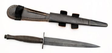A Fairbairn-Sykes fighting knife:, with blued 17.
