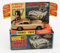 A Corgi James Bond Aston Martin No 261:, in original box, gold body with red interior and figures,