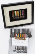 A framed miniature medal group: comprising Queen South Africa Medal with clasps Tugelo Heights,