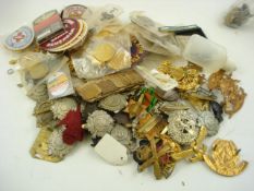 A collection of various British, American and Russian cap badges and cloth badges etc:..