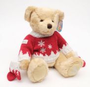 A brown plush Harrods Christmas bear 2008:, in a red and white Christmas jumper.
