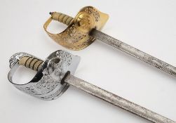 Two Elizabeth II RAF dress swords by Wilkinson, London:, of typical pattern,