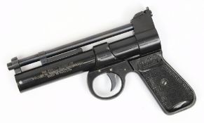 A Webley Junior air pistol:, .177 calibre with black chequered grips.