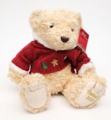 A white plush Harrods Christmas bear 2009:, in a red and white Christmas jumper.