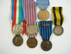 A collection of Italian WWI & WWII service medals:.