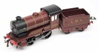Hornby , a Type 501 0-4-0 clockwork locomotive No 5600 with four wheel tender: in LMS maroon livery.