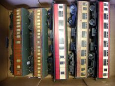 Various makers, three passenger coaches in cream and red livery: and two wooden passenger coaches,