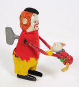 Schuco clockwork figure: clown and dog, 11cm. high.